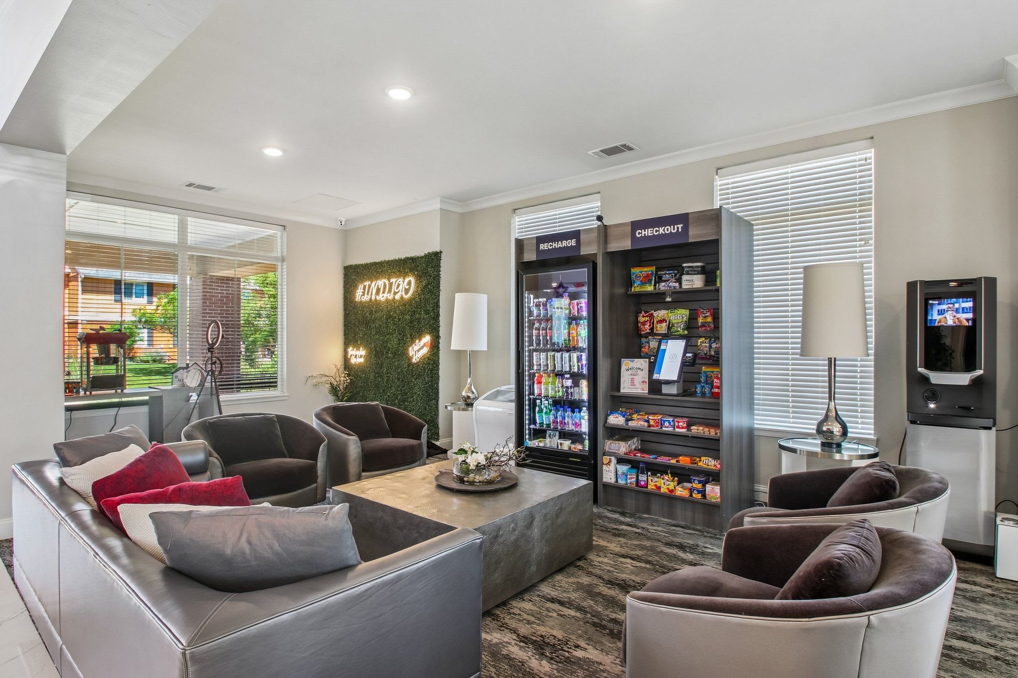 A modern living room with a grey couch and a coffee table.